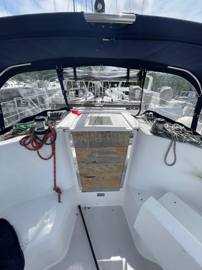 Slide: The Image of 2004 Catalina 350 sailboat cockpit with ropes and wooden hatch. - 7