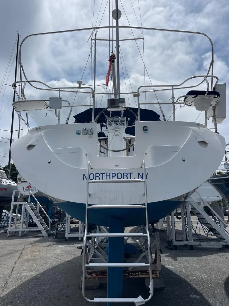 Slide: The Image of 2004 Catalina 350 sailboat docked in Northport, NY, viewed from the stern. - 8