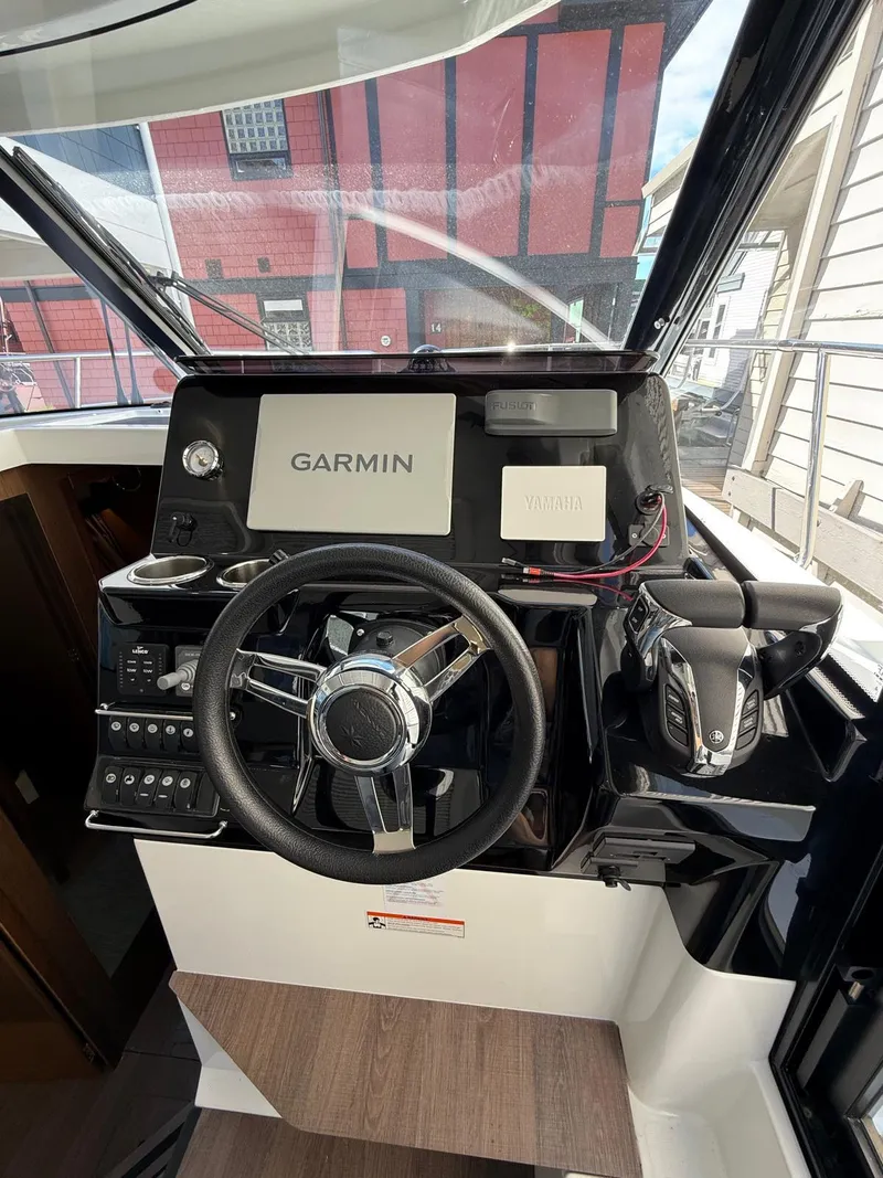 Slide: The Image of 2021 Jeanneau NC Weekender 1095 helm with Garmin navigation system. - 18
