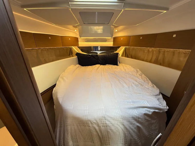 Slide: The Image of Cozy bedroom interior of 2021 Jeanneau NC Weekender 1095 boat with elegant bedding. - 19