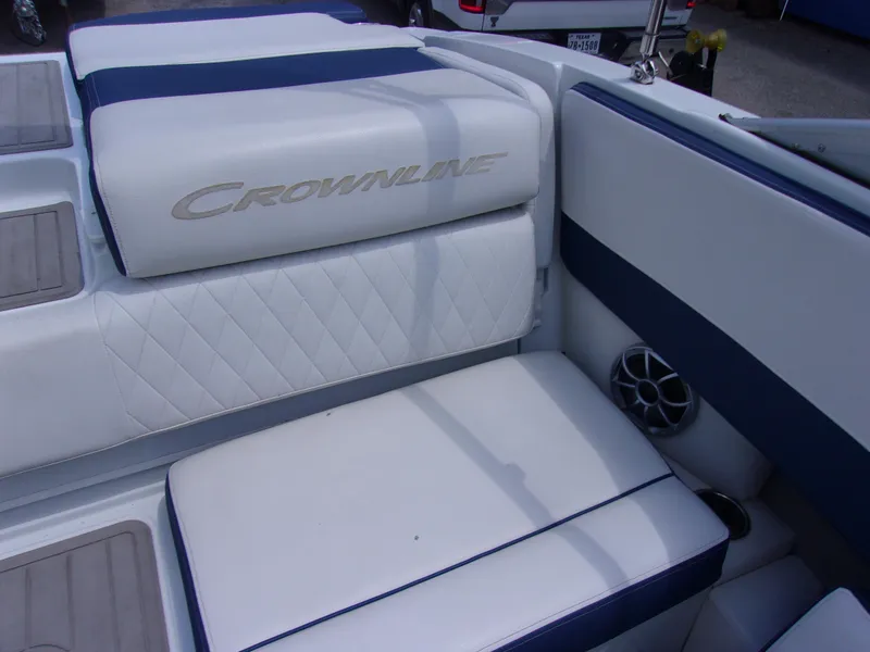 Slide: The Image of 2021 Crownline 210SS boat interior with white and blue seating. - 10