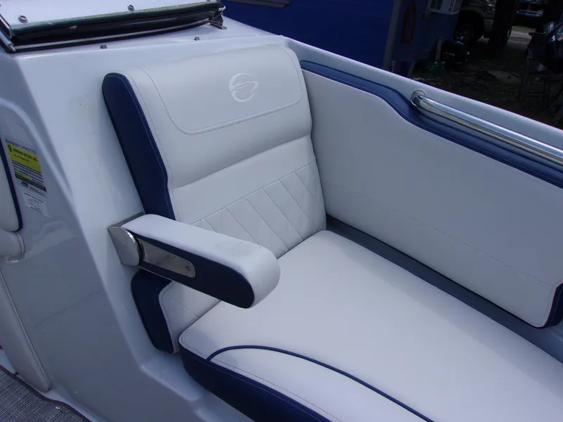 Slide: The Image of 2021 Crownline 210SS boat seat with white and blue upholstery. - 14