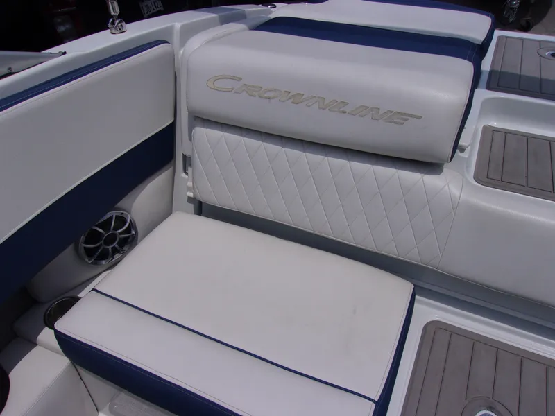 Slide: The Image of 2021 Crownline 210SS boat interior with white and blue seating. - 9