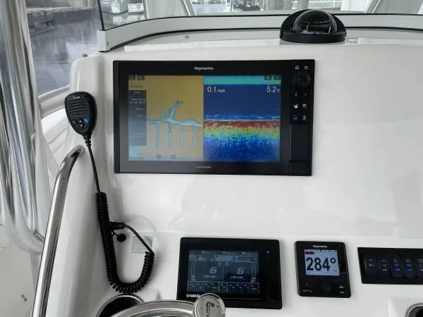 Slide: The Image of Control panel of a 2019 Regulator 31 FS boat with navigation and communication equipment. - 17