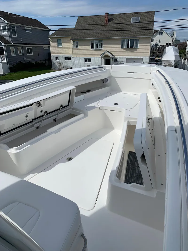 Slide: The Image of 2019 Regulator 31 FS boat with spacious deck and storage compartments. - 24