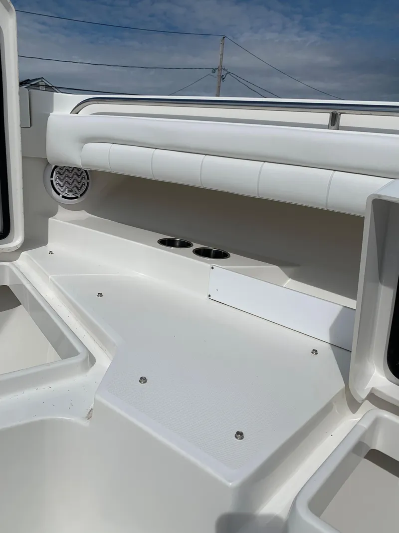 Slide: The Image of 2019 Regulator 31 FS boat interior with cup holders and seating. - 29
