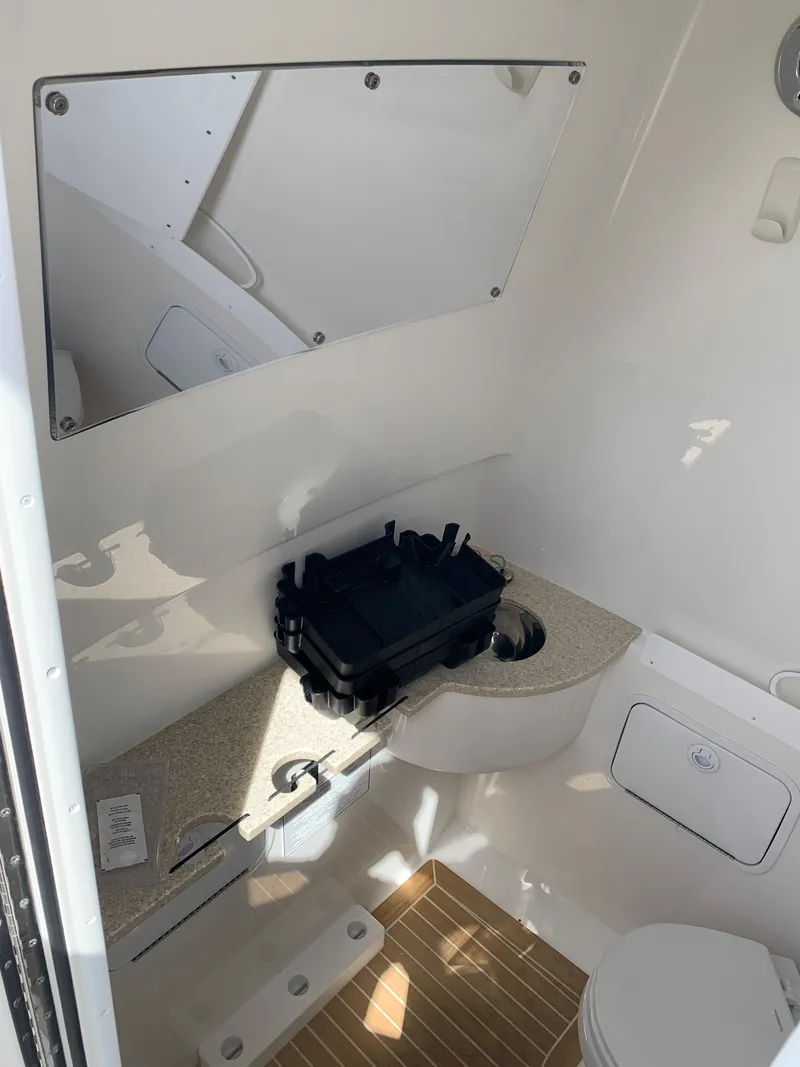 Slide: The Image of 2019 Regulator 31 FS boat interior with storage and seating area. - 37