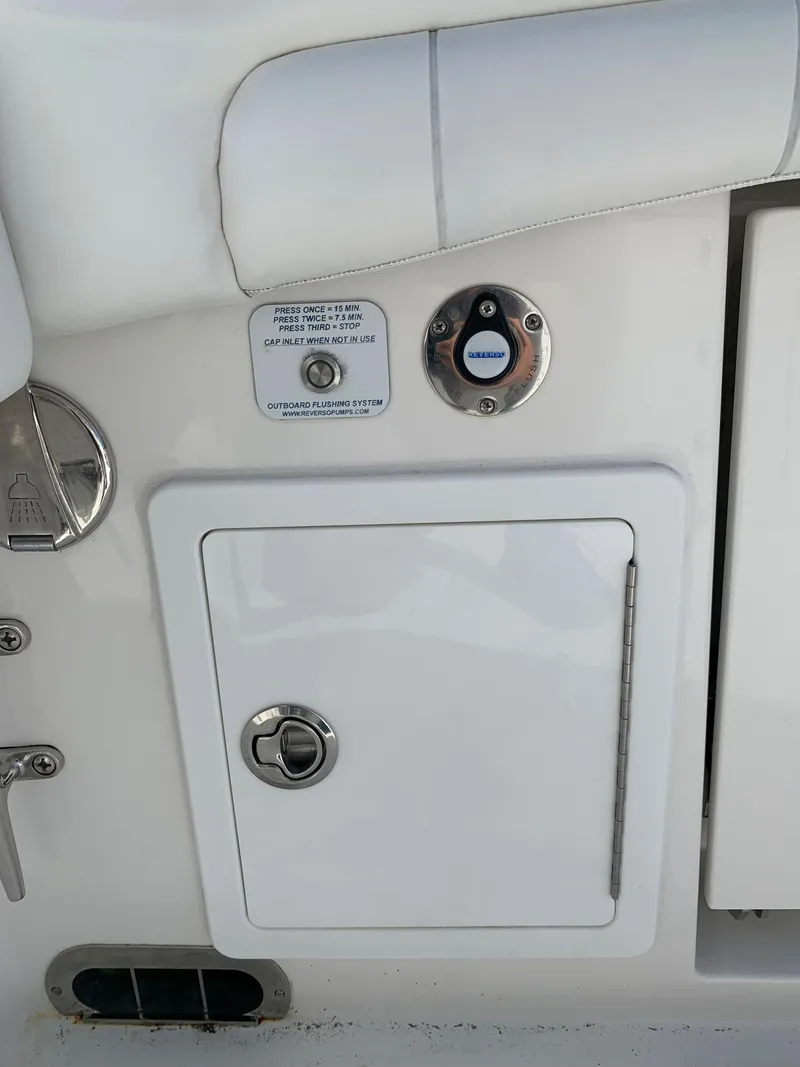 Slide: The Image of 2019 Regulator 31 FS boat control panel with access hatch and switches. - 42