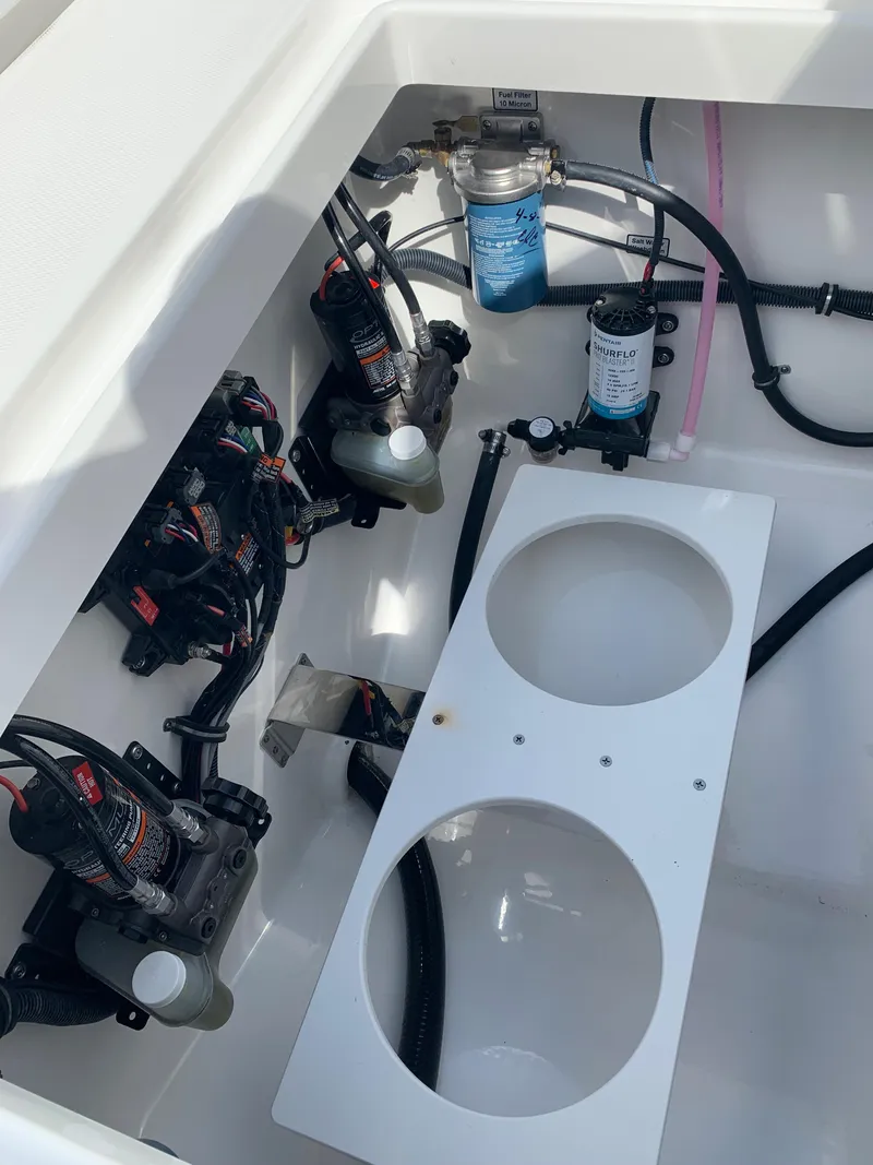 Slide: The Image of 2019 Regulator 31 FS boat wiring and plumbing components in storage compartment. - 43