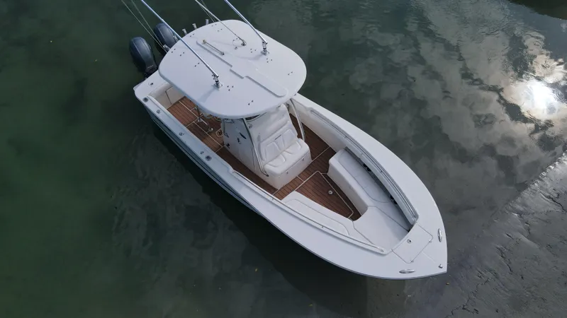 Slide: The Image of 2015 Regulator 25 boat on calm water, aerial view. - 5
