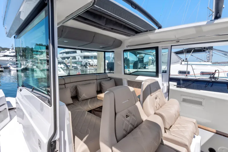 Slide: The Image of Luxurious interior of 2022 Axopar 37 Cross Cabin Brabus Trim with plush seating. - 18