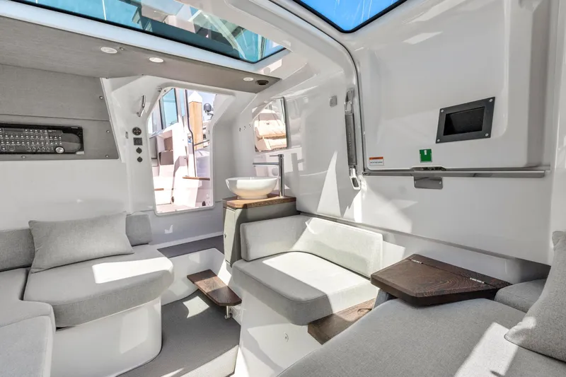 Slide: The Image of Interior of 2022 Axopar 37 Cross Cabin Brabus Trim, featuring modern seating and sleek design. - 20