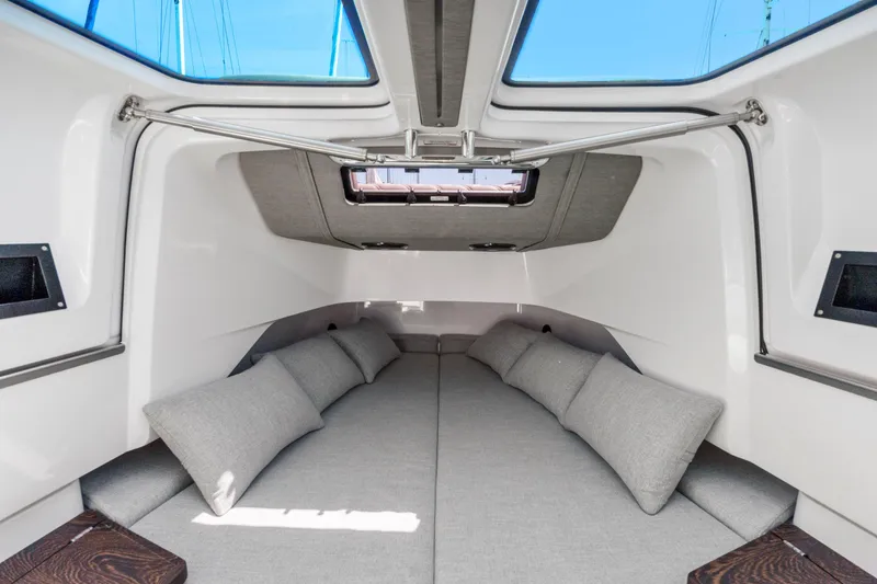 Slide: The Image of Interior of 2022 Axopar 37 Cross Cabin Brabus Trim with gray cushions and skylight. - 21