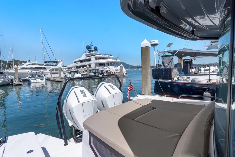 Slide: The Image of Axopar 37 Cross Cabin Brabus Trim 2022 docked at marina with luxury yachts. - 30