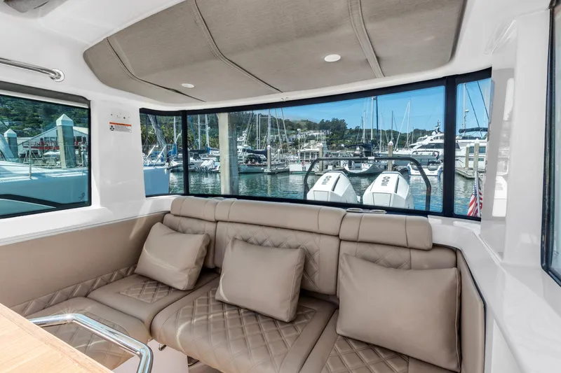 Slide: The Image of Luxurious interior of 2022 Axopar 37 Cross Cabin Brabus Trim with marina view. - 40