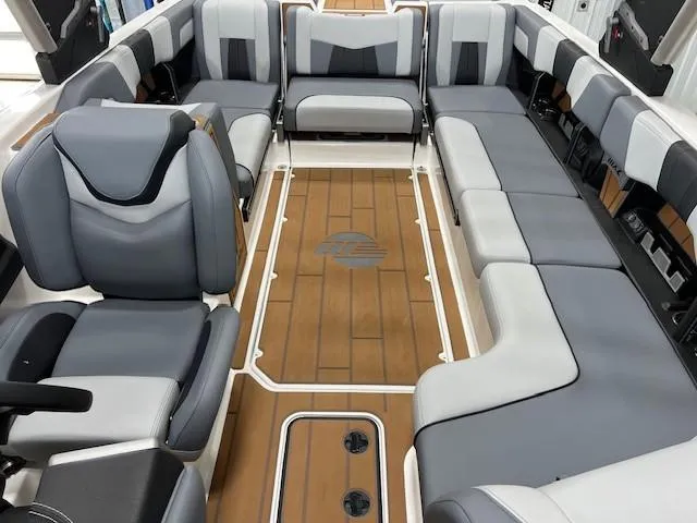 Slide: The Image of 2025 Malibu Wakesetter 24 MXZ interior with spacious seating and elegant design. - 17