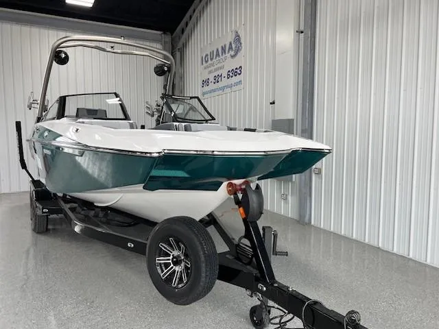 Slide: The Image of 2025 Malibu Wakesetter 24 MXZ boat on trailer in showroom. - 6
