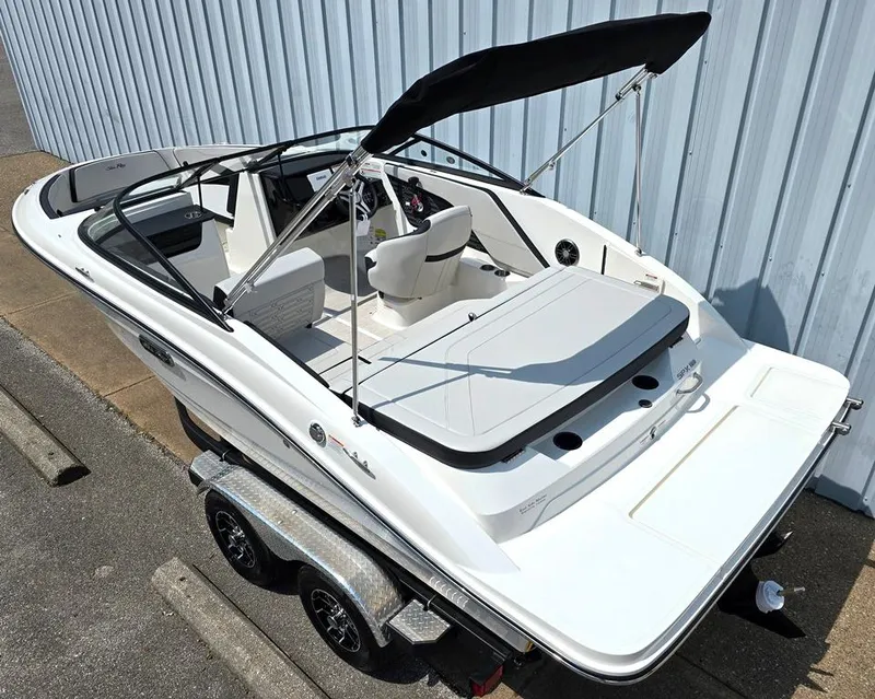 Slide: The Image of 2025 Sea Ray SPX 190 boat on trailer, featuring sleek design and spacious seating. - 2