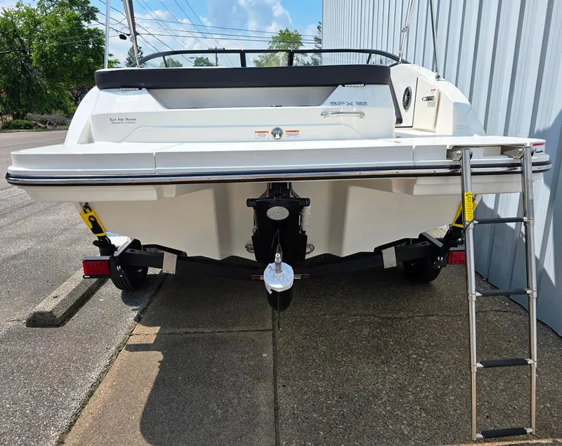 Slide: The Image of 2025 Sea Ray SPX 190 rear view with hideaway sst telescoping 4 step swim ladder. - 9
