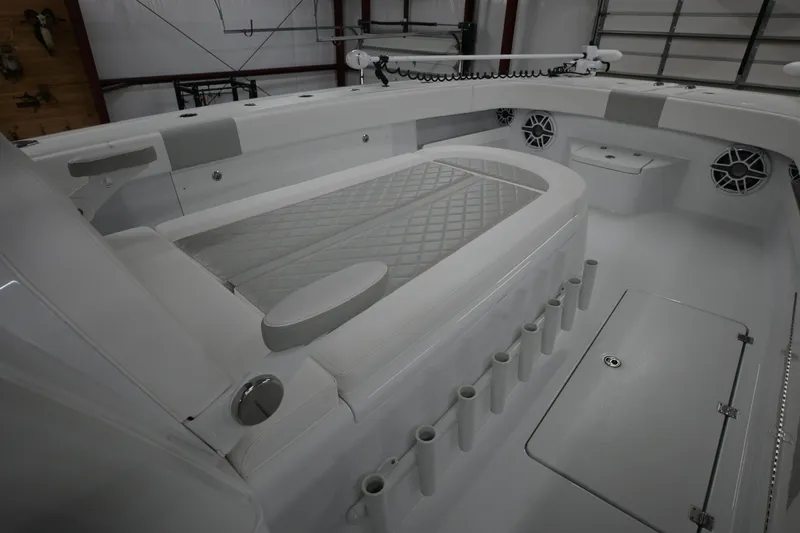 Slide: The Image of Four Mercury Verado outboard engines on a 2024 Freeman 43 boat, glistening on open water. - 13