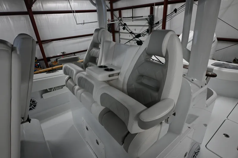 Slide: The Image of 2024 Freeman 43 boat cruising on water with dual outboard engines. - 16