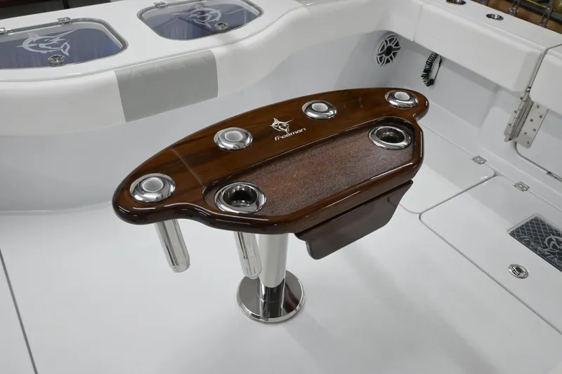 Slide: The Image of Freeman 43 boat interior with wooden table and cup holders, 2024 model. - 28