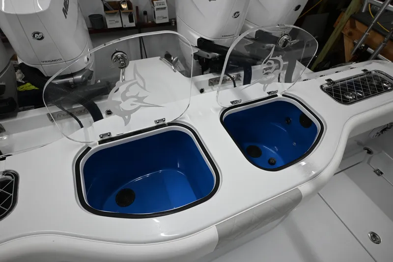 Slide: The Image of 2024 Freeman 43 boat with dual livewells and transparent lids, featuring a sleek design. - 34