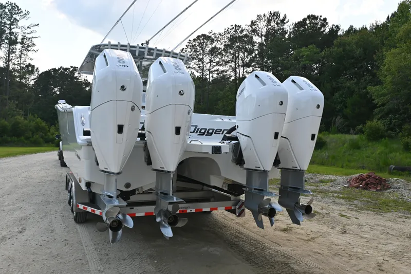 Slide: The Image of 2024 Freeman 43 boat with four powerful outboard motors on a trailer. - 38