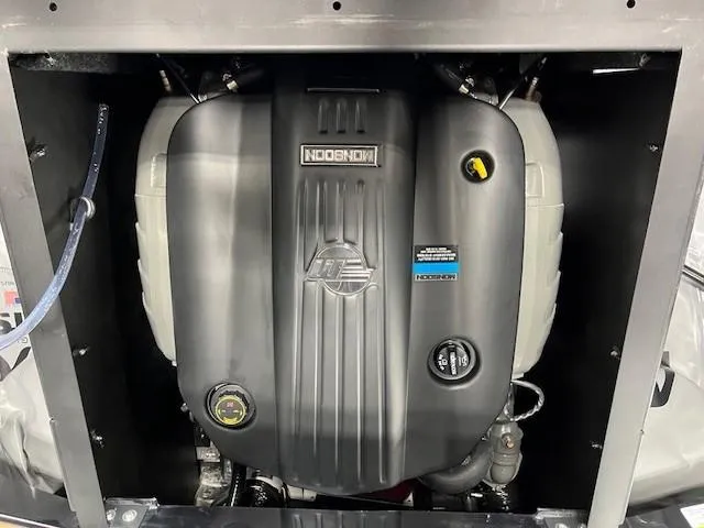 Slide: The Image of 2024 Axis A225 engine compartment showcasing a modern inboard motor. - 11