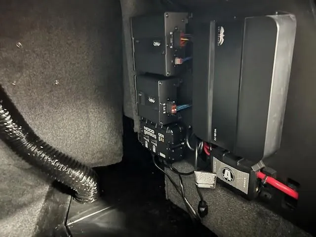 Slide: The Image of 2024 Axis A225 boat interior showing electronic components and wiring setup. - 19