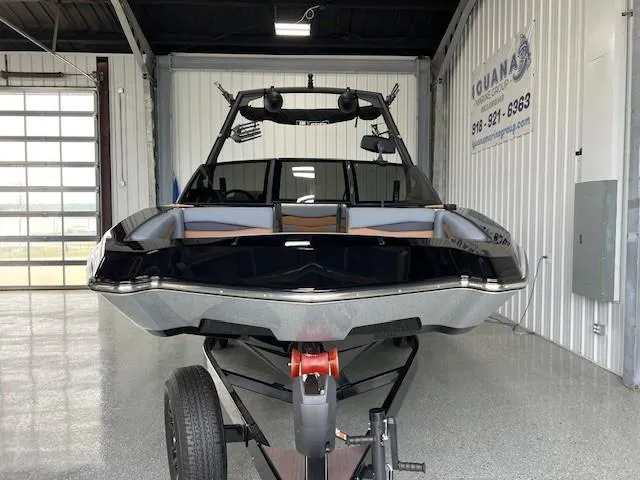 Slide: The Image of 2024 Axis A225 boat on trailer in garage, front view. - 3