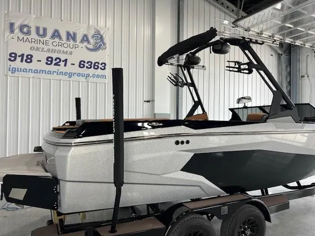 Slide: The Image of 2024 Axis A225 boat on trailer at Iguana Marine Group showroom. - 5