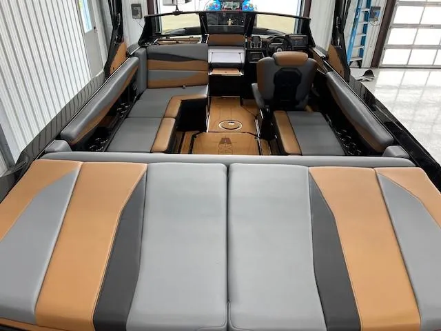 Slide: The Image of 2024 Axis A225 boat interior with gray and tan seating, modern design, and spacious layout. - 8