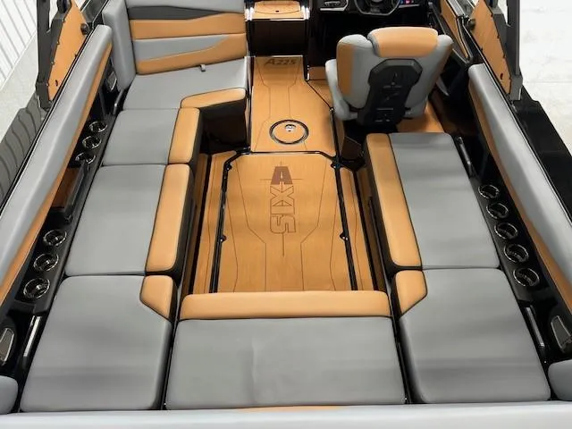 Slide: The Image of 2024 Axis A225 boat interior with gray and tan seating, spacious layout, and modern design. - 9