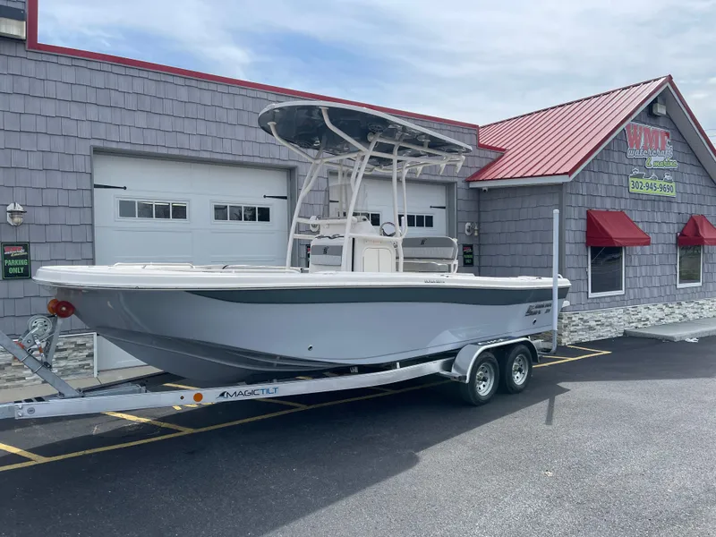 The Image of 2025 Carolina Skiff 21 Ultra Elite boat on trailer, parked outdoors. - 0
