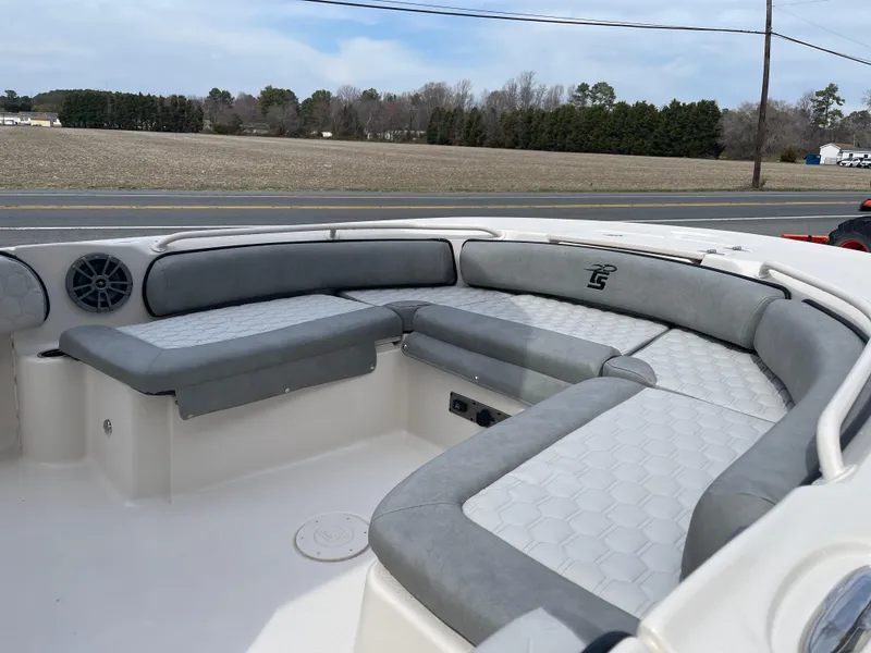Slide: The Image of 2025 Carolina Skiff 21 Ultra Elite boat interior with motor and storage compartments. - 11