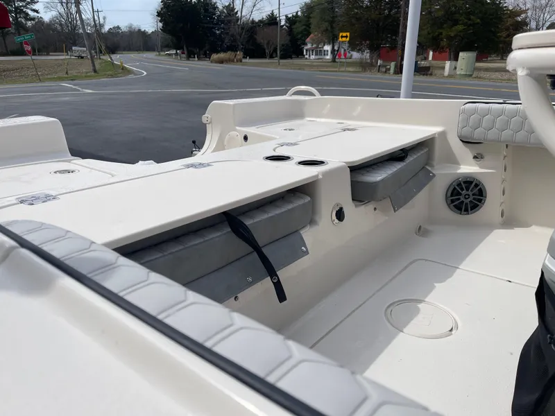 Slide: The Image of 2025 Carolina Skiff 21 Ultra Elite boat interior with cushioned seating and safety features. - 13
