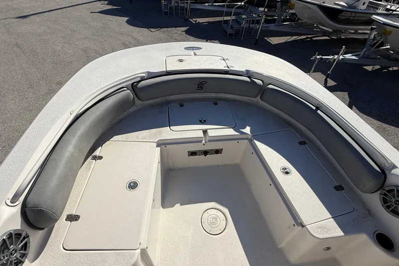 Slide: The Image of 2025 Carolina Skiff 21 Ultra Elite boat interior with cushioned seating and storage compartments. - 19