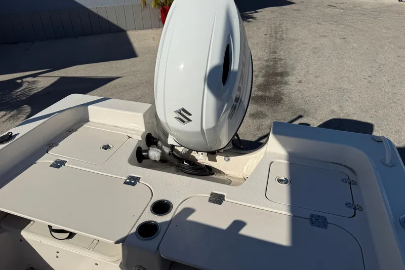 Slide: The Image of 2025 Carolina Skiff 21 Ultra Elite boat with Suzuki outboard motor, rear deck view. - 27