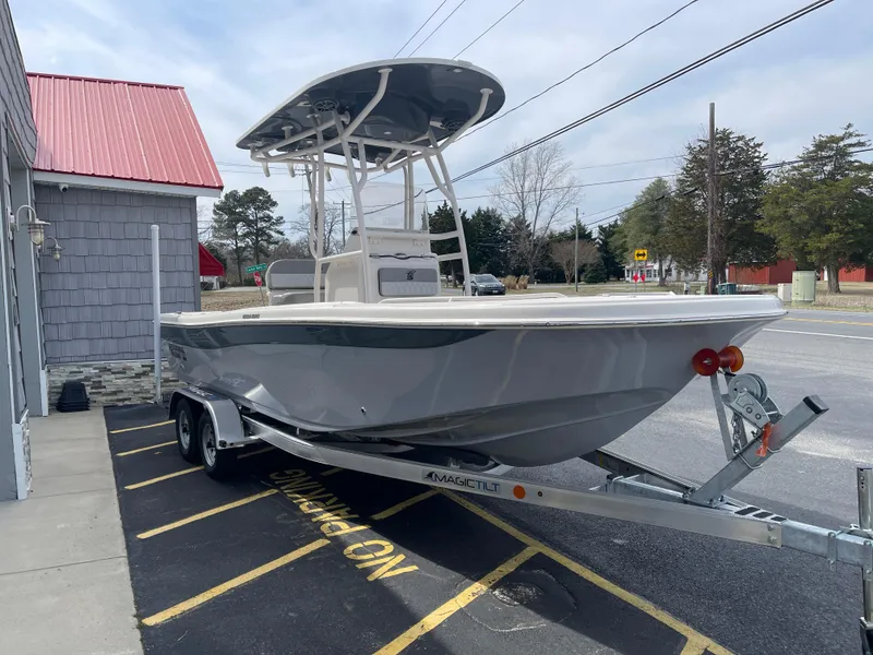 Slide: The Image of 2025 Carolina Skiff 21 Ultra Elite boat on trailer, outdoor dealership setting. - 3