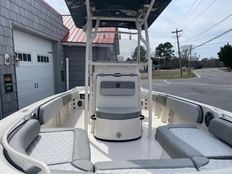 Slide: The Image of 2025 Carolina Skiff 21 Ultra Elite boat with Suzuki outboard motor on trailer. - 5