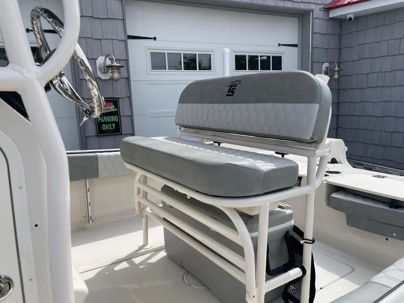 Slide: The Image of 2025 Carolina Skiff 21 Ultra Elite boat interior with steering console and seating. - 9