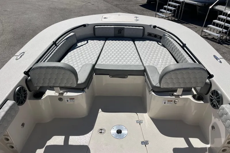 Slide: The Image of 2025 Carolina Skiff 24 Ultra Elite boat interior with gray cushioned seating and modern design. - 18