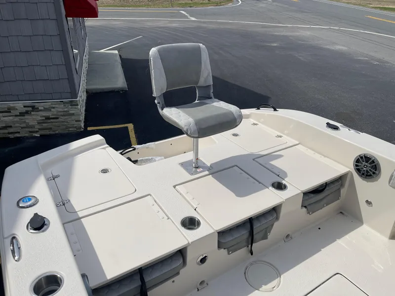 Slide: The Image of 2025 Carolina Skiff 24 Ultra Elite boat deck with seating and storage compartments. - 21