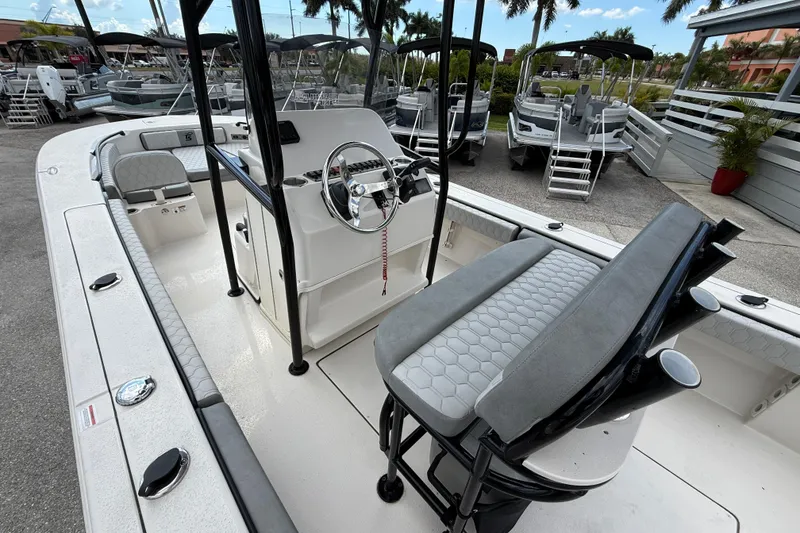 Slide: The Image of 2025 Carolina Skiff 24 Ultra Elite boat interior with steering console and seating. - 22