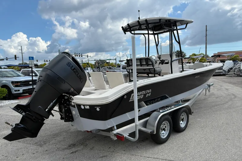 Slide: The Image of 2025 Carolina Skiff 24 Ultra Elite boat on trailer with Suzuki outboard motor. - 5