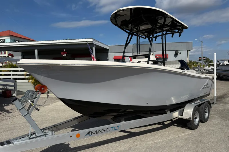 The Image of 2025 Sea Chaser 22 HFC boat on trailer, displayed outdoors under clear sky. - 0
