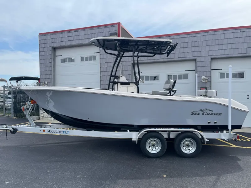 Slide: The Image of 2025 Sea Chaser 22 HFC boat on trailer at WMF Watercraft & Marine dealership. - 2