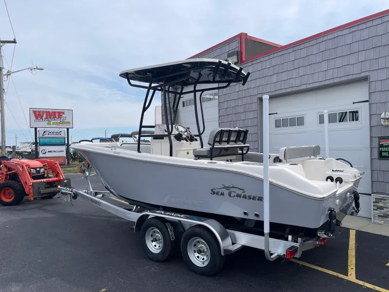 Slide: The Image of 2025 Sea Chaser 22 HFC boat on trailer under clear sky. - 3