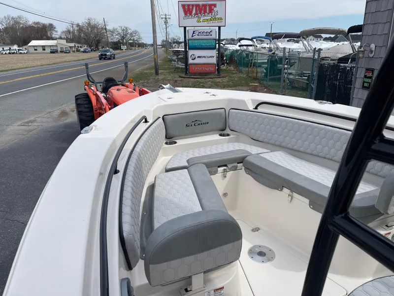 Slide: The Image of 2025 Sea Chaser 22 HFC boat interior with steering console and seating. - 9